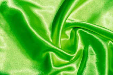 Doku, kumaş, arka plan. Lüks kumaş ya da sıvı dalgalar ya da dalgalı kırışık ipek saten doku kadife malzeme ya da lüks Noel ya da zarif arka plan arka plan. Yeşil