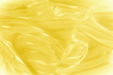 Arka plan doku, desen. Hafif bir şerit ile sarı ipek kumaş. Sarımsı doku. Pürüzsüz zarif sarı saten arka plan.