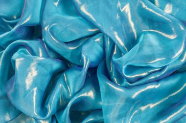 Doku, arka plan, desen. İpek kumaş mavi, ince havadar ipek kumaş, kumaş güneş ışınlarının yansıtır.