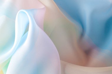 Doku, arka plan, desen. İpek kumaş şeffaf, sarı-pembe yeşil mavi olduğunu. Soyut yumuşak şifon doku arka plan. 