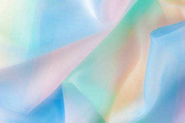 Bulanık, değil keskin netlik doku, arka plan, desen. İpek kumaş şeffaf, sarı-pembe yeşil mavi olduğunu. Soyut yumuşak şifon doku arka plan. 