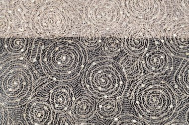 Doku, kumaş, arka plan. Altın iplik iplik ile bir daire desenli dantel kumaş