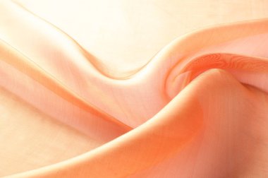 Arka plan doku, desen. Kumaş turuncu olduğunu. Sarı ipek kumaş arka plan güzel ve yumuşak olur. Bir arka plan olarak kullanmak için parlak saten kumaş katlanmış. Kumaş Tekstil yüzey üst türü. Metin alanı