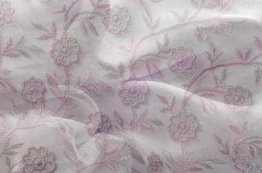 Doku, arka plan, desen. Pembe dantel beyaz arka plan üzerinde. Parlak pembe beyaz dantel ile. Çiçekler Lacy desenle. Doku pembe dantel arka plan, duvar kağıdı için kapalı