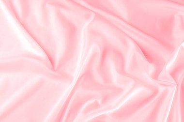 arka plan doku. ipek kumaş pembe. Bu toz pembe ipek dokuma bahar romantik bir hava verir. Onun nazik sesi yapım o pürüzsüz ve parlak saten gibi yüz sunar. 