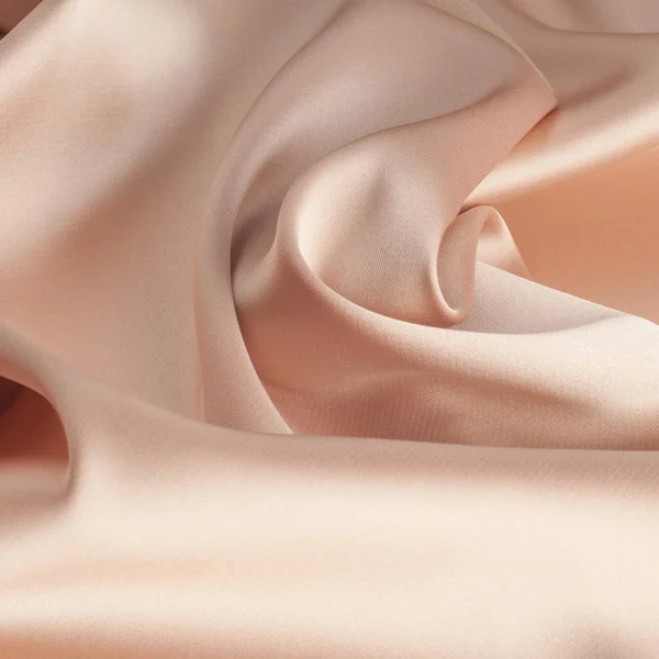 tissue, textile, cloth, fabric, material, texture. beige color. cloth, typically produced by weaving or knitting textile fibers.