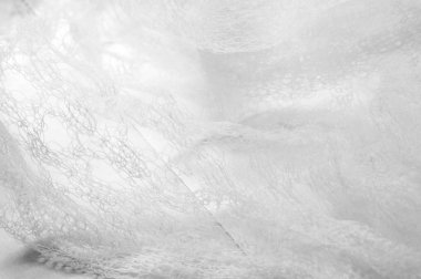 Bir un sayesinde bir örgü doku arka plan deseni beyaz kumaş