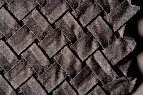 Текстура, фон, узор, ткань из переплетенной складки — стоковое фото