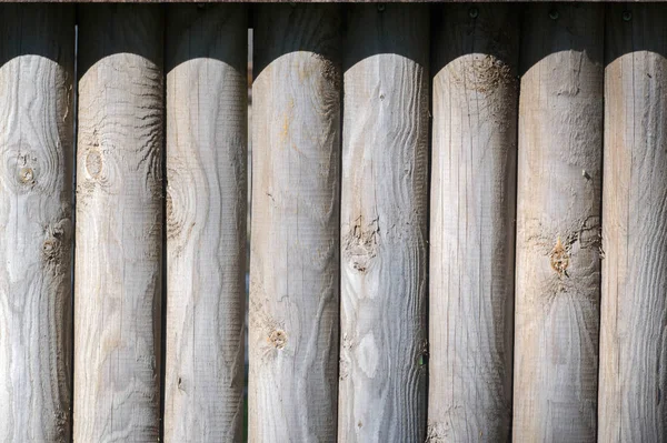 Texture, sfondo, pattern. Recinzione di barre di legno, non dipinte , — Foto Stock