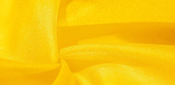 Textur, Hintergrund, Muster, Seidenstoff in gelb. diese Seide i — Stockfoto