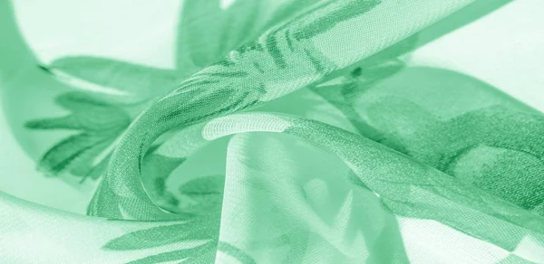 Texture background, pattern, wallpaper. white silk fabric, green
