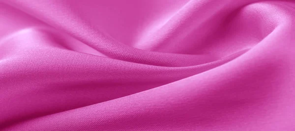 texture. Pink silk fabric. brilliant luster and characteristic