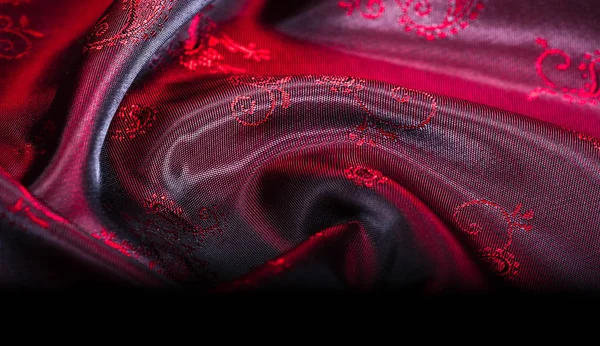 Texture, fabric, red silk with paisley pattern. This beautiful p