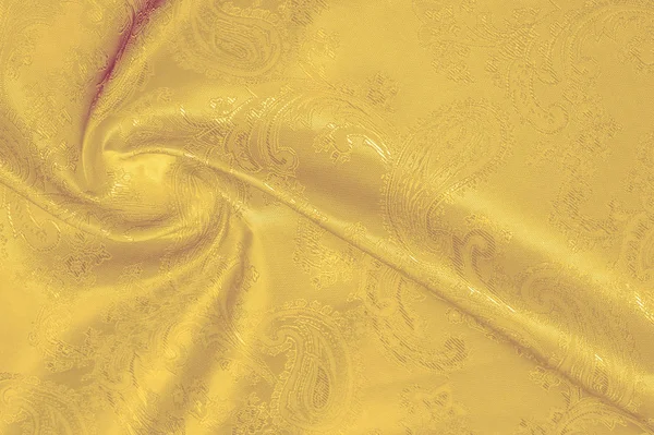 Текстура, фон, шелковая ткань желтая. Это желтое пятно — стоковое фото
