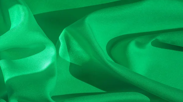 Textura, tecido de seda de cor verde, luz sólida sati seda verde — Fotografia de Stock