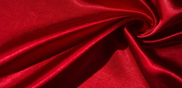 Texture, background, pattern, silk fabric of red color. This ado — Stock Photo, Image