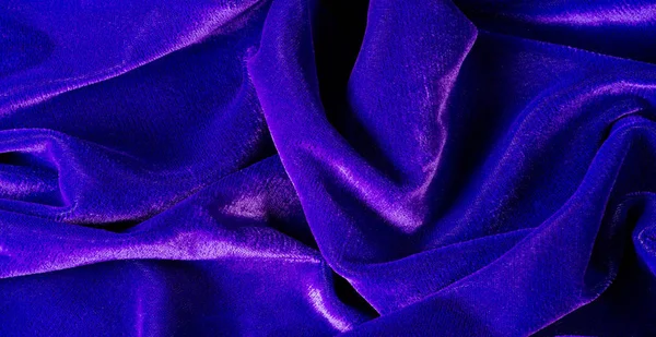 Picture. Texture, background. The velvet fabric is blue, the ric — Stock Photo, Image