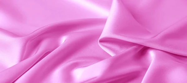 テクスチャ。ピンクのシルク生地。鮮やかな光沢と特徴 — ストック写真