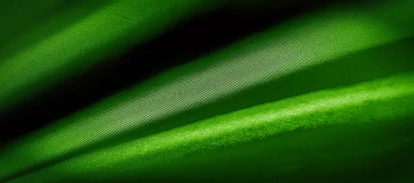 Текстура, фон, узор. зеленый шелк ткани панорамное фото . — стоковое фото