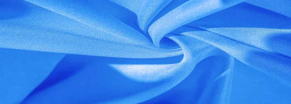 Текстура, фон, візерунок, суцільна світло-блакитна шовкова атласна тканина — стокове фото
