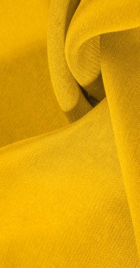 arka plan, desen, doku, süs, vintage. yapay granüller ile sarı kumaş. pelet rulo. Bu yüksek kaliteli, hafif, pürüzsüz kollu streç pamuklu kumaş