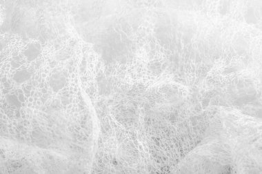 Bir un sayesinde bir örgü doku arka plan deseni beyaz kumaş