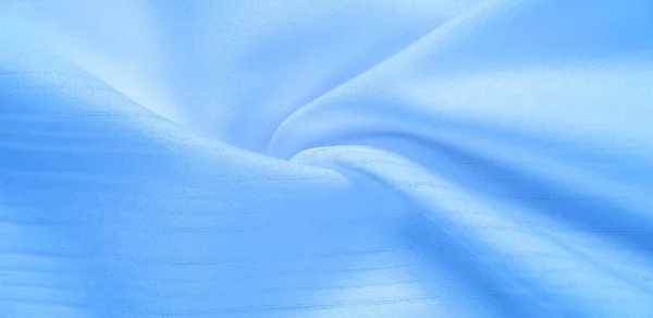 Текстура фона, рисунок. шелковая голубая ткань. От Телио, это — стоковое фото