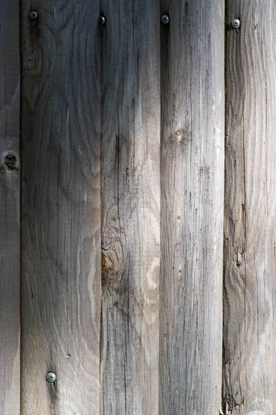 Textura, fundo, padrão. Cerca de barras de madeira, não pintadas , — Fotografia de Stock