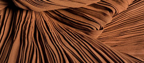 Textura, pozadí, vzorek, tkanina gofre hnědá. Meruňkové barvy. — Stock fotografie