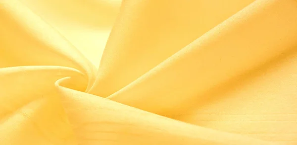 texture background, pattern. silk yellow fabric. From Telio, thi