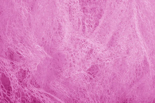 Fabric in a mesh of pink color. this is a micro-thin mesh, which
