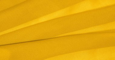 arka plan, desen, doku, süs, vintage. yapay granüller ile sarı kumaş. pelet rulo. Bu yüksek kaliteli, hafif, pürüzsüz kollu streç pamuklu kumaş