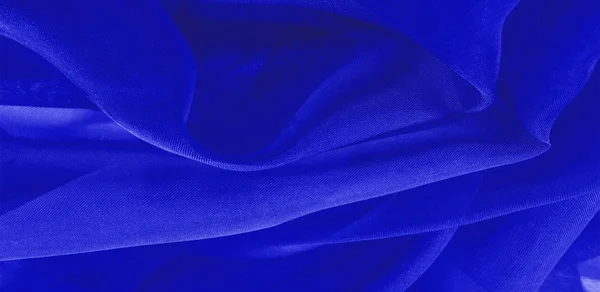 Texture of blue silk fabric. It is also perfect for your design,