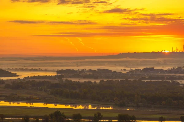 Summer landscape of the river. Sunrise sunset. A constant flow of water of considerable size with a natural flow along the channel from the source to the mouth. stream, flood, nulla, effluent