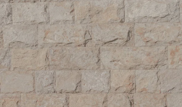 texture, background, design, faceted wild stone in the decoration of buildings, interior decoration