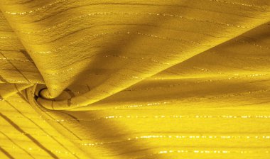 Tasarım arka plan dokusu, sarı kehribar rengi kumaş. Taze ve rahat bir stil için mükemmel..