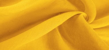 Doku. İpek sarı mat renginin arkaplan kumaşı (boya veya yüzey) sönük ve düzdür, parlaklığı yoktur.