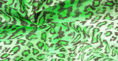 Doku, arkaplan, desen, ipek kumaş yeşil, leopar desenli. Hafif leopar desenli ipek tasarımınız için mükemmel, şık görünüyor ve kaba değil.!