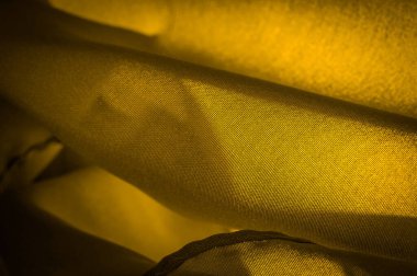 Doku, arkaplan, desen, saten sarı sepia genellikle parlak bir yüzeye ve donuk bir sırta sahip bir dokumadır, saten dokuma dört ya da daha fazla dolgu ipliği ile karakterize edilir.