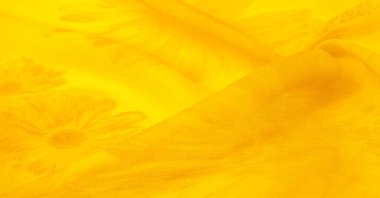 Arkaplan dokusu, sarı ipek kumaş boyalı çayır çiçekleri, spektrumda yeşil ve turuncu arasında renkler, ana çıkarıcı renk, olgun limon ya da yumurta sarısı gibi boyanmış..