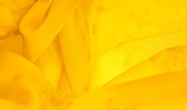 Arkaplan dokusu, sarı ipek kumaş boyalı çayır çiçekleri, spektrumda yeşil ve turuncu arasında renkler, ana çıkarıcı renk, olgun limon ya da yumurta sarısı gibi boyanmış..