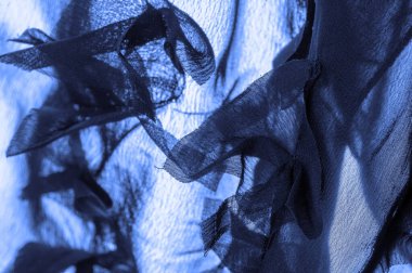 Doku. Geçmişi. Mavi ipek kumaş, üst manzara. Pürüzsüz mavi ipek ya da saten kumaş dokusu, kopyalama alanı olan soyut bir arkaplan olarak kullanılabilir.