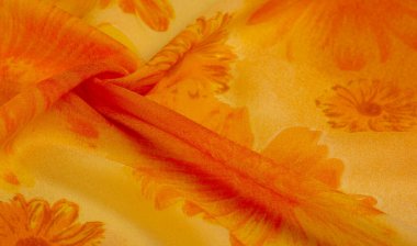 Arkaplan dokusu, boyalı çayır çiçekleri olan turuncu ipek kumaş.