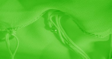 Arka plan, desen, doku, duvar kağıdı, yeşil soluk ipek kumaş parlak bir ışıltıya sahip. Bu çok yönlü bir kumaş. Tasarımının güzel aksanlarıyla yaratıcı ol..