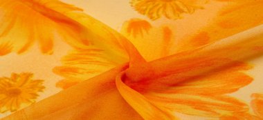 Arkaplan dokusu, boyalı çayır çiçekleri olan turuncu ipek kumaş.