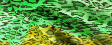 Doku, arkaplan, desen, ipek kumaş yeşil, leopar desenli. Hafif leopar desenli ipek tasarımınız için mükemmel, şık görünüyor ve kaba değil.!