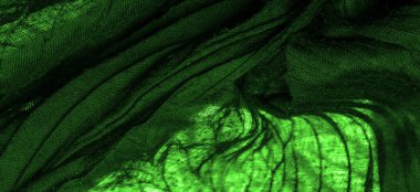 Doku. Geçmişi. Geçmişi. Koyu yeşil, parlak kumaş dokusu, bu soyut bir ipek kumaş arkaplanı.