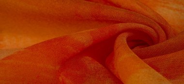 Arkaplan dokusu, boyalı çayır çiçekleri olan turuncu ipek kumaş.