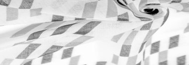 Doku. Geçmişi. Şablon. Siyah geometrik eşkenar dörtgen şekilli beyaz ipek kumaş. karanlık, samur, ebon, müstehcen