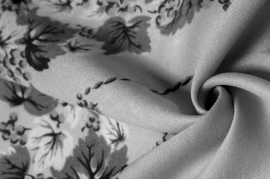 Doku, arka plan, şekil, Crepe de Chin. Bej rengi, mavi çiçekler. Bu bir ipek grubu, pürüzle karakterize edilmiş, aynı zamanda hafif kırışık..